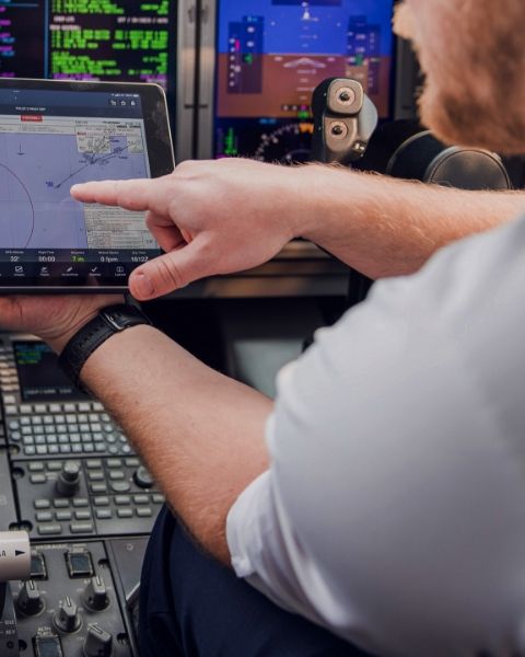 a pilot in a plane cockpit